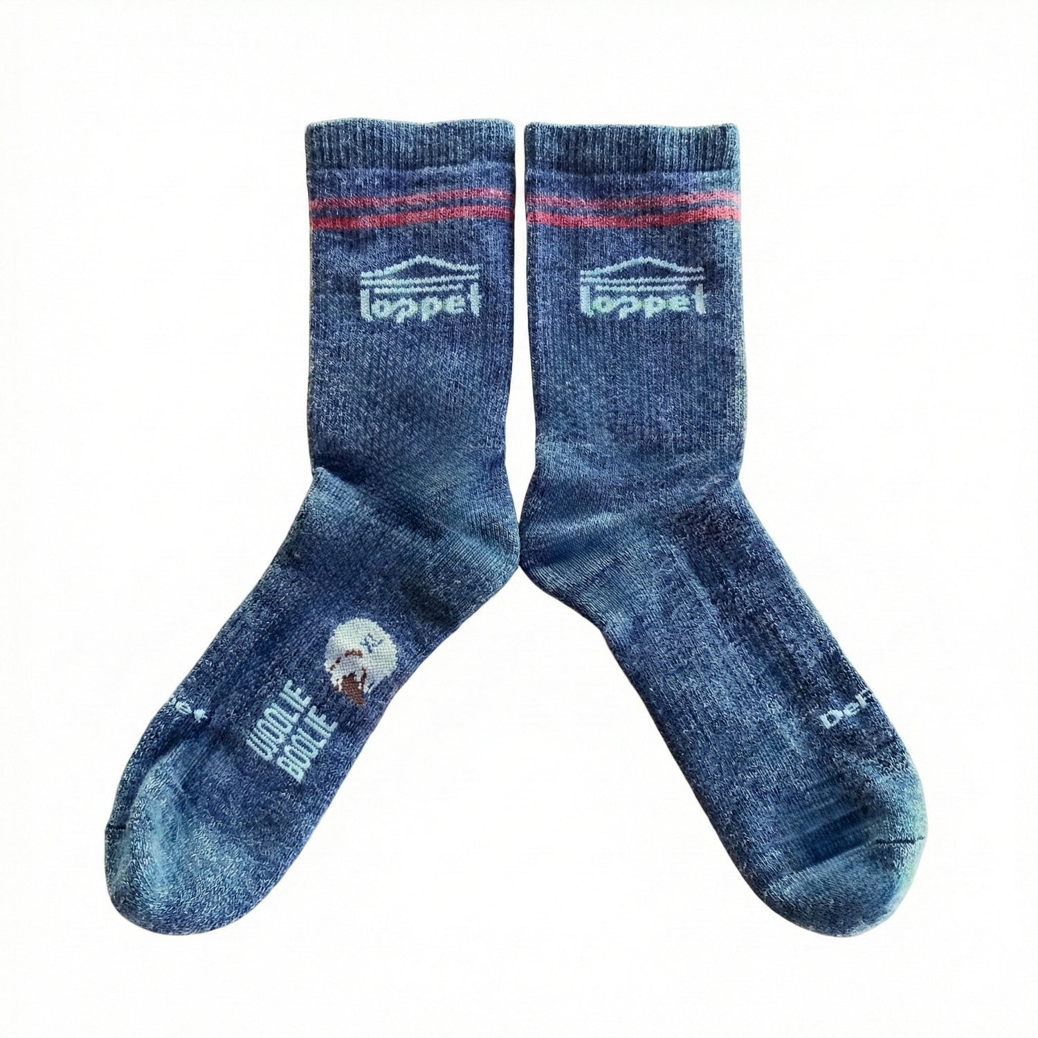 Pair of blue socks with branding on a white background
